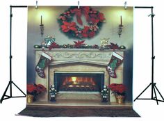 a christmas fireplace with stockings and poinsettis on it