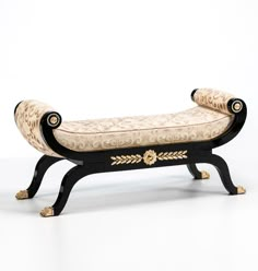 an ornate bench with gold and black accents