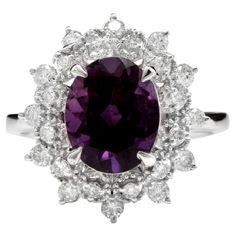 3.60 Carats Natural Amethyst and Diamond 14K Solid White Gold Ring Total Natural Oval Shaped Amethyst Weights: Approx. 3.00 Carats Amethyst Measures: Approx. 10 x 8mm Natural Round Diamonds Weight: Approx. 0.60 Carats (color G-H / Clarity SI1-SI2) Ring size: 7 (we offer free re-sizing upon request) Ring total weight: Approx. 4.3 grams Disclaimer: all weights, measurements and colors are approximate and may vary slightly from the listed dimensions or as seen in the image. All pictures are magnifi Amethyst And Diamond Ring, Crystal Goddess, Emerald Cut Rings, Diamond Jewelry Designs, Etsy Gold Ring, Amethyst Gem, Purple Band, Tourmaline Ring, Bling Rings