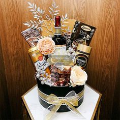 a fancy gift basket on top of a table