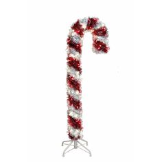 a candy cane decorated with red and white tinsel