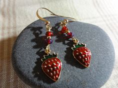 Small strawberry charms are 3/4" tall and 3/8" wide.  They are bright red and gold enamel and very shiny.  Earrings hang at 1" with red glass beads. Very much the summer look! Red Enamel Drop Earrings, Red Enamel Dangle Earrings, Red Earrings With Dangling Charms For Gift, Strawberry Earrings, Shiny Earrings, Strawberry Charm, Gold Enamel, Summer Look, Beaded Jewelry Diy