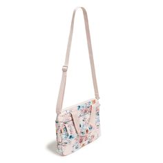 a pink floral purse with straps on it's sides and an adjustable strap around the shoulder