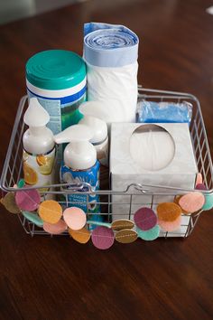 a basket filled with lots of items on top of a wooden table