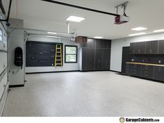 an empty garage with lots of cabinets in it