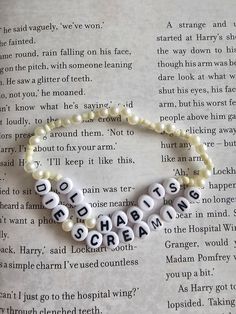 a beaded bracelet with words written on it