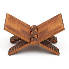 a wooden object that looks like an ornament