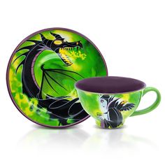 an image of a dragon dinnerware set with purple rimmed cups and saucers