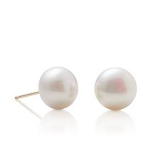 Simple statements of elegance, pearls have been a mainstay in Gump's fine jewelry assortment for decades. Revered for their alluring luster and classic beauty, they are widely recognized as symbols of purity, integrity and wisdom gained through experience. To create these earrings, each pearl is carefully selected for quality, color and shape. Freshwater cultured button pearls, 10mm. 14-karat yellow gold. Pierced only. Elegant White Pearl Earrings With Pearl Buttons, Refined Round Pearl Earrings As Gift, Refined Round Pearl Earrings For Gift, Timeless Round Pearl Earrings As Gift, Elegant Round Pearl Earrings With High Luster, Elegant High Luster Pearl Earrings, Classic Round Pearl Drop Earrings, Elegant Pearl White Earrings With High Luster, Elegant Pearl Button Earrings For Formal Occasions