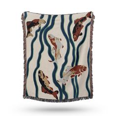 a fish print throw blanket with fringes on the bottom and two goldfishs in the middle