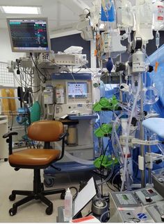 an operating room with medical equipment in it