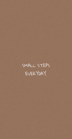 the words small steps everyday are written in white ink on a brown background with black and white writing