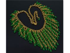 "Eye catching French emerald green Gripoix glass waterfall cascade bib necklace C.1950. The necklace comprised of gold plated chain with cascade of drippy gold chain fringes. Hand made emerald green Gripoix glass droplets populate the fringes creating waterfall effect. The necklace is 18\" end to end with J hook clasp. The longest fringe in the center is approx. 2 3/4\" long. The droplets are approx. 7 mm long. The necklace weighs 53 grams. Excellent vintage condition." Glass Waterfall, Cascade Necklace, Necklace C, Chain Fringe, Long Fringes, Hook Clasp, Bib Necklace, Bead Jewelry, Gold Plated Chains