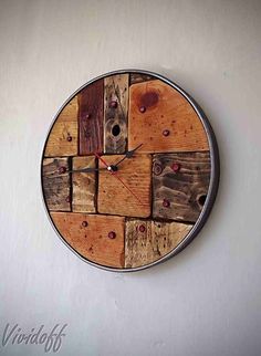 a clock made out of wooden planks on the wall