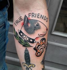 a man's leg with tattoos on it and the words true friends written in black ink