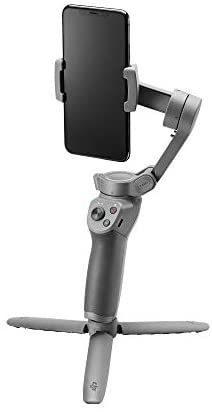 an image of a cell phone holder attached to the arm of a robot that is holding a tablet