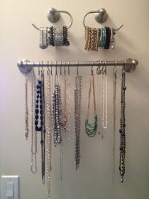 there are many necklaces hanging on the wall