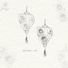 two chinese lanterns with flowers on them are drawn in pencil and ink, one has a tasseled handle