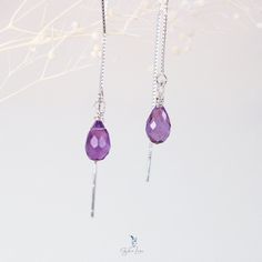 Bring some elegant-minimalistic flair to your jewelry collection with these ethereal teardrop Amethyst ear threaders. Made from a beautiful faceted natural Amethyst stone and delicate 925 sterling silver box chain threaders, these earrings are the perfect gift for yourself or a loved one. Amethyst is known as a protective stone, capable of easing both physical and mental distress. It is also highly regarded as a spiritual stone, promoting selflessness and spiritual wisdom. These Amethyst ear thr Purple Sterling Silver Teardrop Earrings, Purple Sterling Silver Teardrop Earrings For Gift, Handmade Sterling Silver Dangle Threader Earrings, Handmade Sterling Silver Long Drop Threader Earrings, Gift Threader Earrings With Adjustable Chain, Adjustable Long Drop Threader Earrings, Adjustable Hypoallergenic Threader Earrings For Gift, Delicate Adjustable Threader Earrings With Long Drop, Delicate Adjustable Sterling Silver Threader Earrings