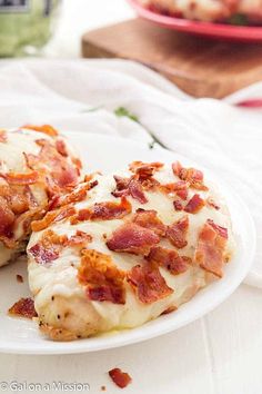 two slices of pizza on a white plate