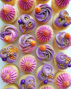 cupcakes decorated with purple and orange icing