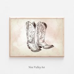 a drawing of a pair of cowboy boots on a wall with the words, nire valley art