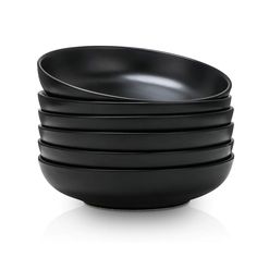 four black bowls stacked on top of each other