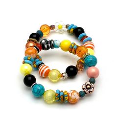 This is a 120% happy and uplifting bracelet combo, mainly saturated bright shades of sky blue and turquoise, orange and yellow.  Check out the different patterns also.  Sweet embellishments of rhinestone and mixed metals also... I am betting color affects us more than we might admit.  Face it, most of us are moved by color and often will seek out a favorite color combo = perhaps this is one of yours.    OOAK/one of a kind as usual.  Enjoy my classic boutique style.  And check out all the little timeless details.  Forever in style. ►►These currently fit a 6 inch wrist.  If you need an adjustment, please measure wrist with fabric tape measure or string and Etsy convo me so that we can discuss prior to purchase. ►►Special request?  If you are seeking a similar type bracelet but in specific co Adjustable Vibrant Blue Jewelry, Vibrant Adjustable Blue Jewelry, Vibrant Blue Adjustable Jewelry, Vibrant Blue Round Bead Jewelry, Vibrant Adjustable Yellow Beaded Bracelets, Playful Turquoise Beaded Bracelets With Colorful Beads, Vibrant Adjustable Bracelets, Multicolor Round Beaded Bracelets With Vibrant Style, Multicolor Stackable Round Beads Jewelry