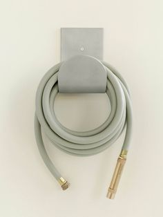 an electrical device with two wires attached to the wall and one plugged into it