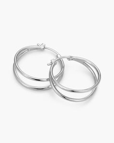 Our women's X Hoop Earrings in silver showcase double hoops intertwined for a chic and dynamic design. Crafted with a polished finish and a 925 sterling silver post, these earrings add a touch of contemporary flair to any ensemble. Solid Gold Chains, Dynamic Design, Silver Shop, Men's Rings, Pendant Bracelet, Silver Hoop Earrings, Chain Pendants, Ring Bracelet, Chain Bracelet