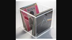 a stack of cd's in a clear box