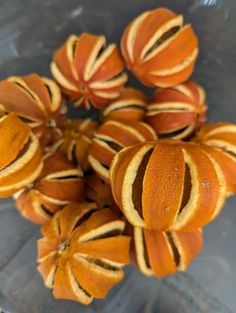 a bunch of oranges sitting on top of a glass table next to each other