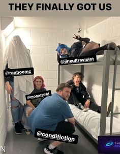 a group of people sitting on top of bunk beds in a room with white walls