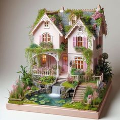 a doll house with flowers and plants on the roof is shown in front of a white background