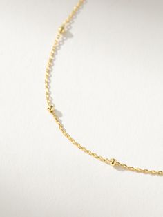 Instead of going round and round with your necklace stack, make this everyday chain necklace your go-to staple. Crafted with a dainty chain and gold bead details, our Satellite Chain Necklace is the ultimate layering necklace. For an effortless everyday look, pair this silver or gold necklace with anything from our Dainty Jewelry Collection. Minimalist Satellite Chain Necklace For Layering, Dainty Everyday Satellite Chain Necklace, Minimalist Layered Necklace With Satellite Chain, Everyday Minimalist Station Necklace With Delicate Chain, Dainty Ball Chain Necklace For Everyday, Dainty Everyday Ball Chain Necklace, Dainty Station Necklace With Delicate Chain For Layering, Minimalist Station Necklace With Delicate Chain For Layering, Minimalist Beaded Chain Layered Necklace