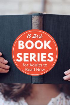 a person holding up a book with the title 15 best book series for adults to read now