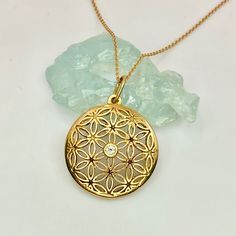 "Fine 18k solid gold flower of life pendant medallion with a glistening genuine diamond centre. This mystical sacred geometry pendant is the perfect gift for the love of Self or the one you Love ! Can be ordered as a pendant only or with a 18\" chain. All our Diamonds stones are Ethically sourced Custom orders Welcomed! (can be custom ordered in Rose or White Gold and with a stone of your choice) To see more: https://www.etsy.com/shop/templejewelsibiza?ref=listing-shop-header-item-count§ion_id=2 Gold Flower Gemstone Jewelry, Gold Flower-shaped Gemstone Jewelry, Gold Flower Shaped Jewelry With Gemstone, Gold Flower Pendant With Brilliant Cut, Gold Flower-shaped Jewelry With Brilliant Cut, Gold Jewelry With Brilliant Cut Flower, Gold Brilliant Cut Flower Jewelry, Gold Brilliant Cut Flower Shaped Jewelry, Gold Brilliant Cut Flower Pendant Jewelry