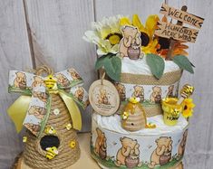 there are two cakes decorated with winnie the pooh decorations