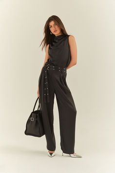 Woman wearing a silk black belted pant with a matching silk top. Satin Pant, Silky Pants, Double Belt, Luxe Style, Satin Pants, Silky Fabric, Silver Hardware, Classic Black, Black Pants