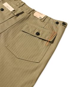 FORTELA olive green trousers. Two front patch pockets. Two back patch pockets with flap and button. Loose fit. Adjustable buttons on the waist. Front Closure with Buttons. Herringbone fabricComposition: 100% Cotton Cotton Workwear Pants With Flap Pockets, Faded Utility Pants With Pockets, Olive Cotton Bottoms With Patch Pockets, Olive Relaxed Fit Bottoms With Side Pockets, Olive Relaxed Fit Cotton Bottoms, Olive Green Trousers, Green Trousers, Herringbone Fabric, Classic Trousers