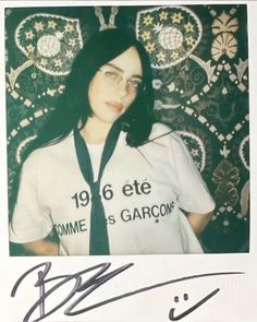 an autographed photograph of a woman wearing a shirt and tie with the name bonnie s garcom on it