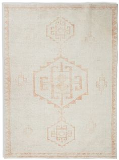 an orange and white rug on a white background with two different colored designs in the middle