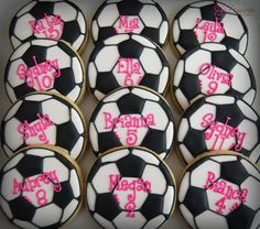 decorated cookies in the shape of soccer balls with name and age for girls on them