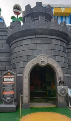 the entrance to an amusement park that is designed like a castle