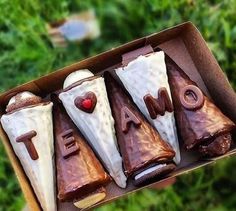 some kind of food in a box on the grass