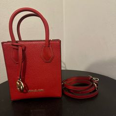 Never Used Michael Kors Handbag With Crossbody Strap Square Bags With Gold-tone Hardware For Shopping, Red Square Satchel With Detachable Handle, Red Square Box Bag With Top Carry Handle, Red Square Box Bag With Top Handle, Double Handle Shoulder Bag With Gold-tone Hardware As Gift, Gift Satchel With Gold-tone Hardware And Double Handle, Gold-tone Hardware Shoulder Bag With Double Handle, Red Crossbody Box Bag With Top Carry Handle, Red Square Satchel With Top Carry Handle