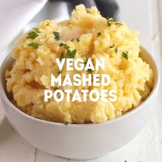 a white bowl filled with mashed potatoes on top of a table