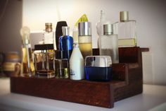 Hand crafted Cologne shelf, Perfume Display, and Aftershave bottle rack in reclaimed mocha stain finish, or other finishes noted below. Do you or your loved one have many cologne bottles scattered on top of a dresser or on the bathroom counter? Well we have the perfect gift for the man (or human) who has everything. This perfume or cologne display stand helps to organize that bottle collection to make it attractive and easy to find your favorite scent. Single shelf for a few bottles to display, Cologne Display, Unique Husband Gifts, Wine Bottle Shelf, Bottle Organizer, Cologne Collection, Cologne Bottles, Perfume Storage, Cologne Bottle, Perfume Display