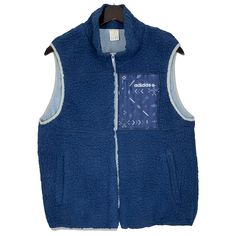 Adidas NEO Fleece Vest Jacket Outdoor Hiking Sportswear Blue Color Size Medium * Made in : China * Size on Tag : L * Manual Measurement (inch) : Chest 20, Length 25, Shoulder 15.5, Hem 17. * Recommended for Size : Medium (M) * Color : Blue * Condition : Used * See photos for details. * Free Defect : No Stain, No Holes, No Tears, No Faded. 95 Winter Sportswear Activewear With Pockets, Winter Activewear With Pockets, Sporty Outerwear With Fleece Lining For Cold Weather, Sportswear Fleece-lined Winter Track Jacket, Winter Sportswear Track Jacket With Fleece Lining, Hooded Sports Vest, Casual Winter Activewear For Outdoor, Casual Winter Outdoor Activewear, Sporty Windproof Fleece Jacket For Streetwear