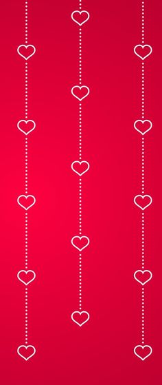 hearts are hanging from a line on a red background with white lines in the middle